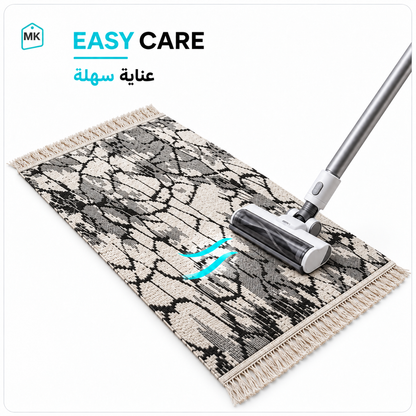 Black & White rug 90 × 60 cm easy-care surface being vacuum cleaned