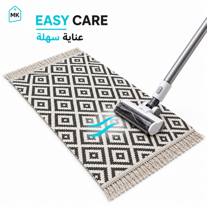 Brown & White rug 90 × 60 cm easy-care surface being vacuum cleaned