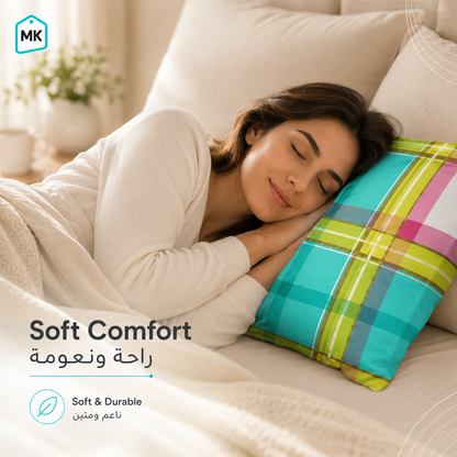 A woman rests on a bed with her eyes closed, supported by a colorful plaid pillow. She is wrapped in a soft cream blanket, with a cozy bedroom background.